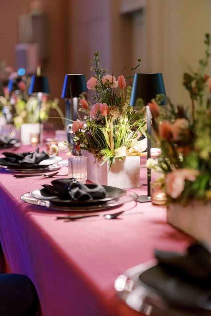 wedding reception with florals and place settings