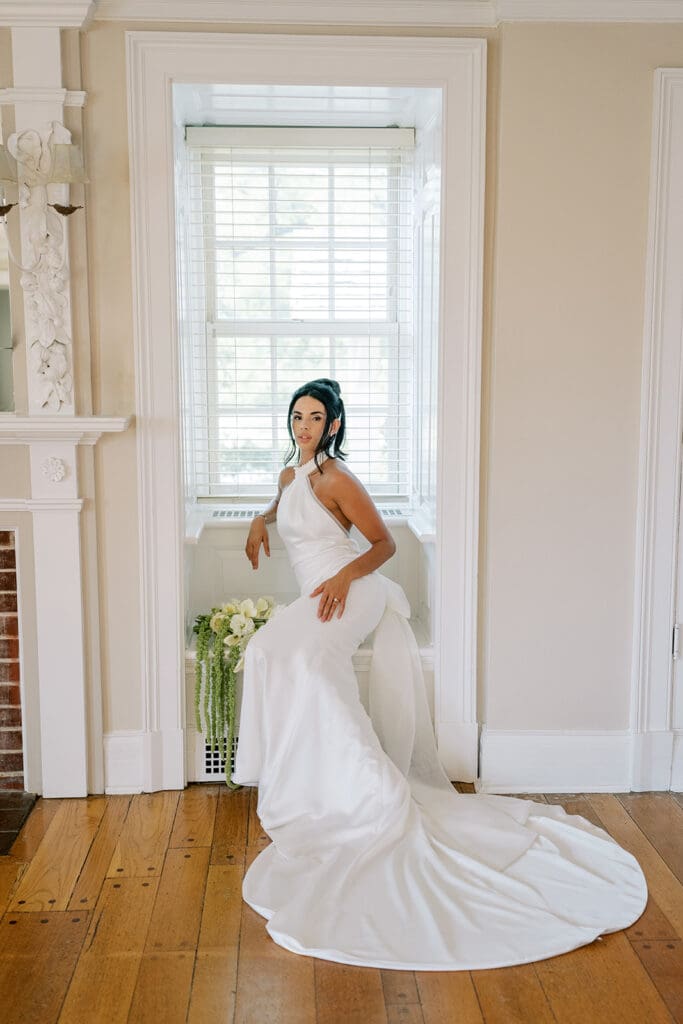 Bride in side with bouquet at The French House