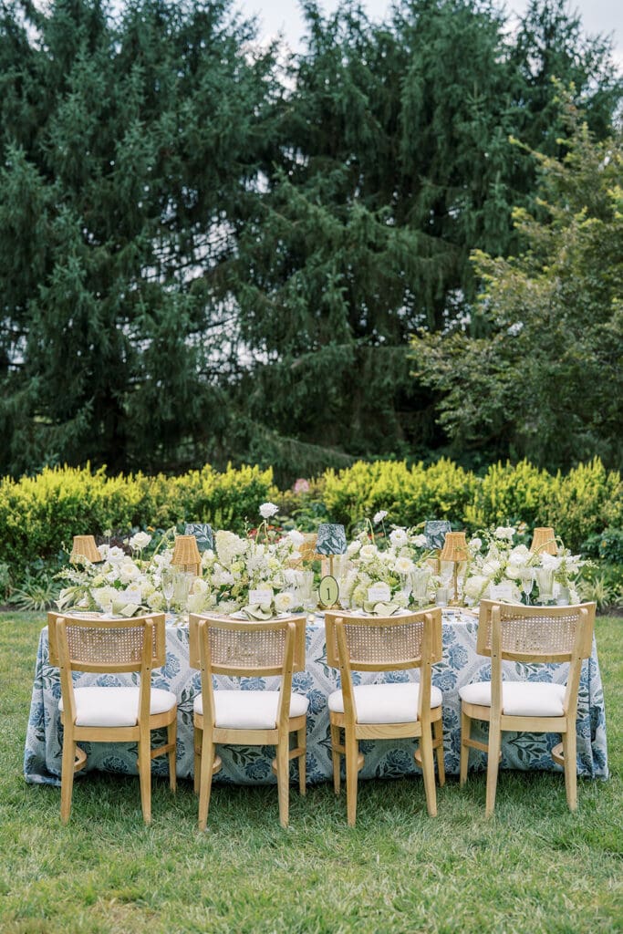 The French House wedding reception table in garden with flowers