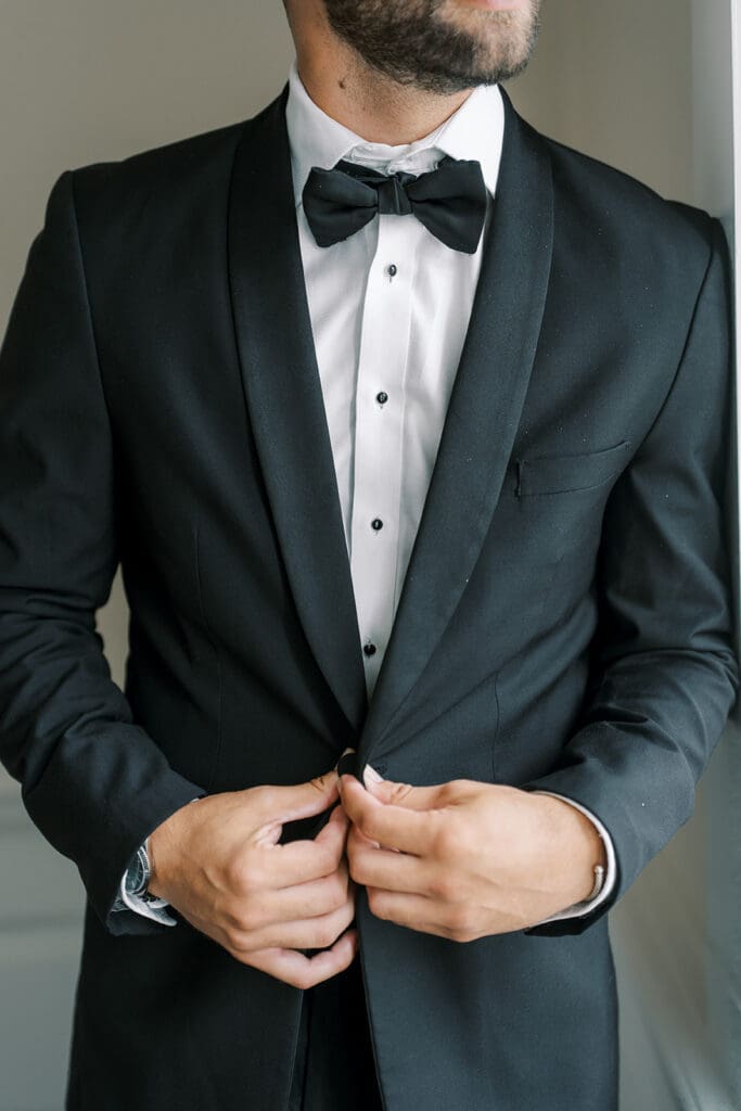 The French House groom in black tuxedo 