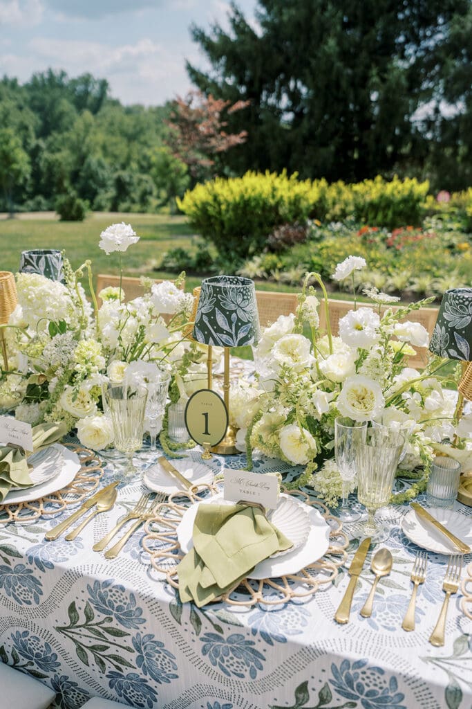 The French House garden wedding with table number and lamps with flowers