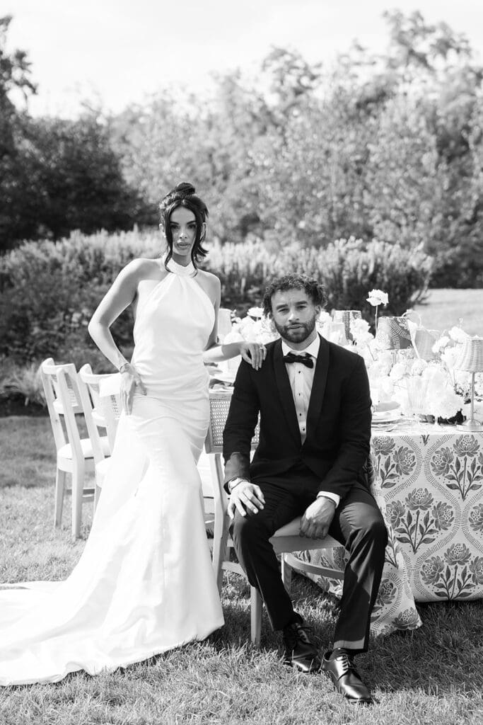 The French House sitting at wedding reception table. 