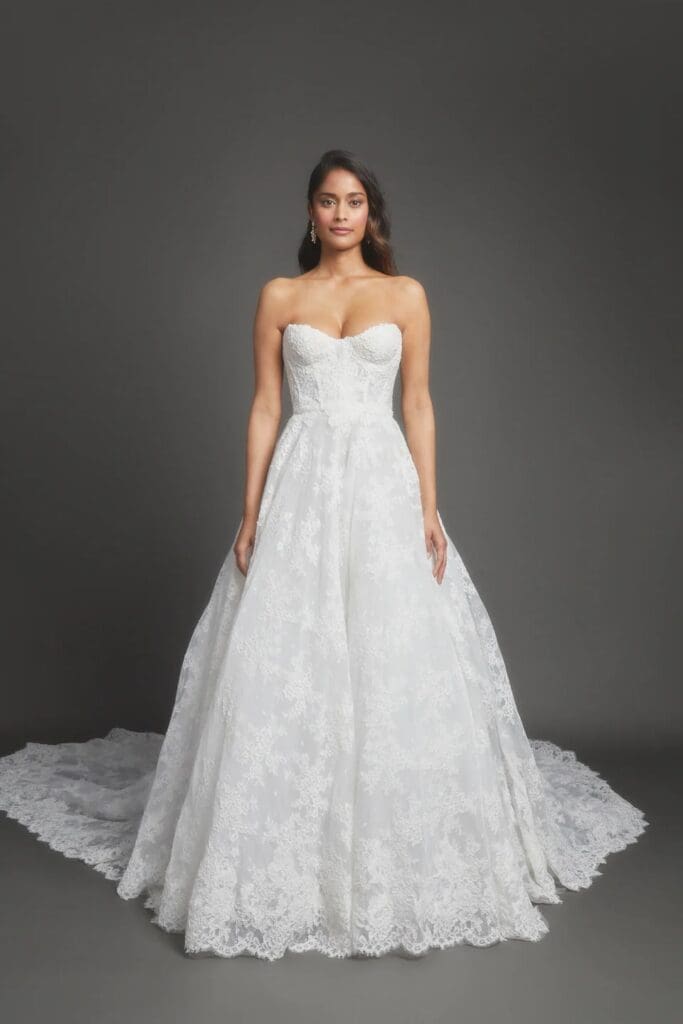elegant, strapless white lace ball gown wedding dress with a sweetheart bodice and a sweeping train 