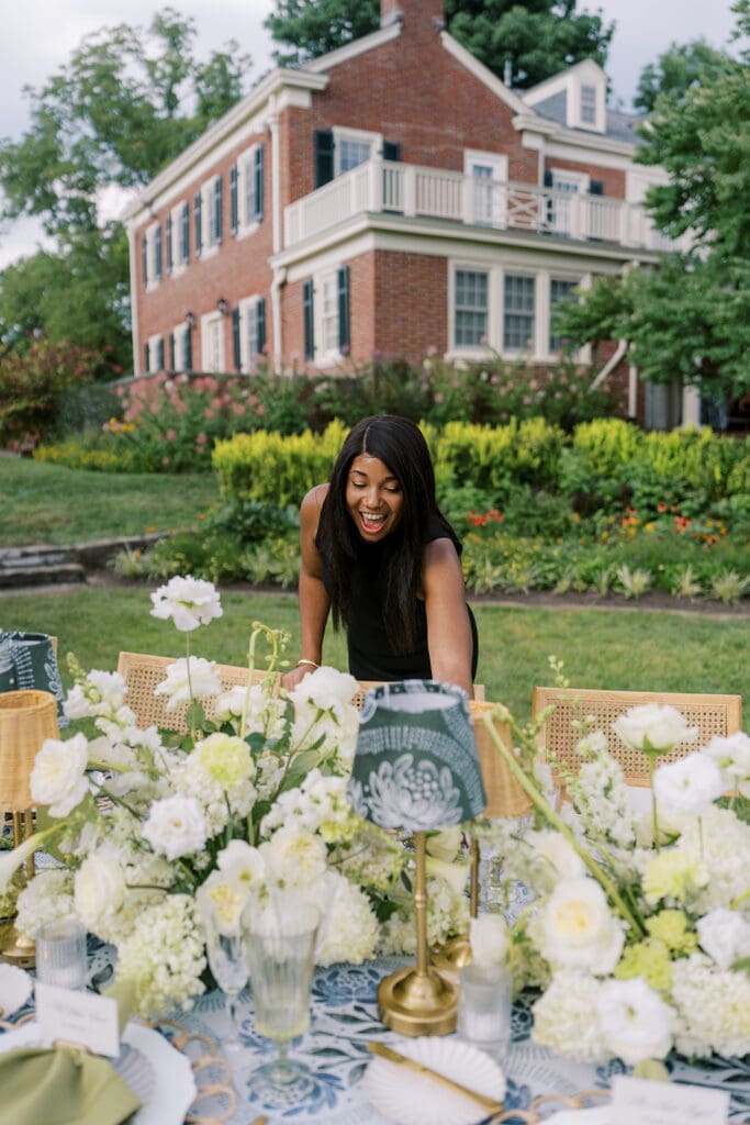 Wedding planner in Cincinnati setting reception table at French House 